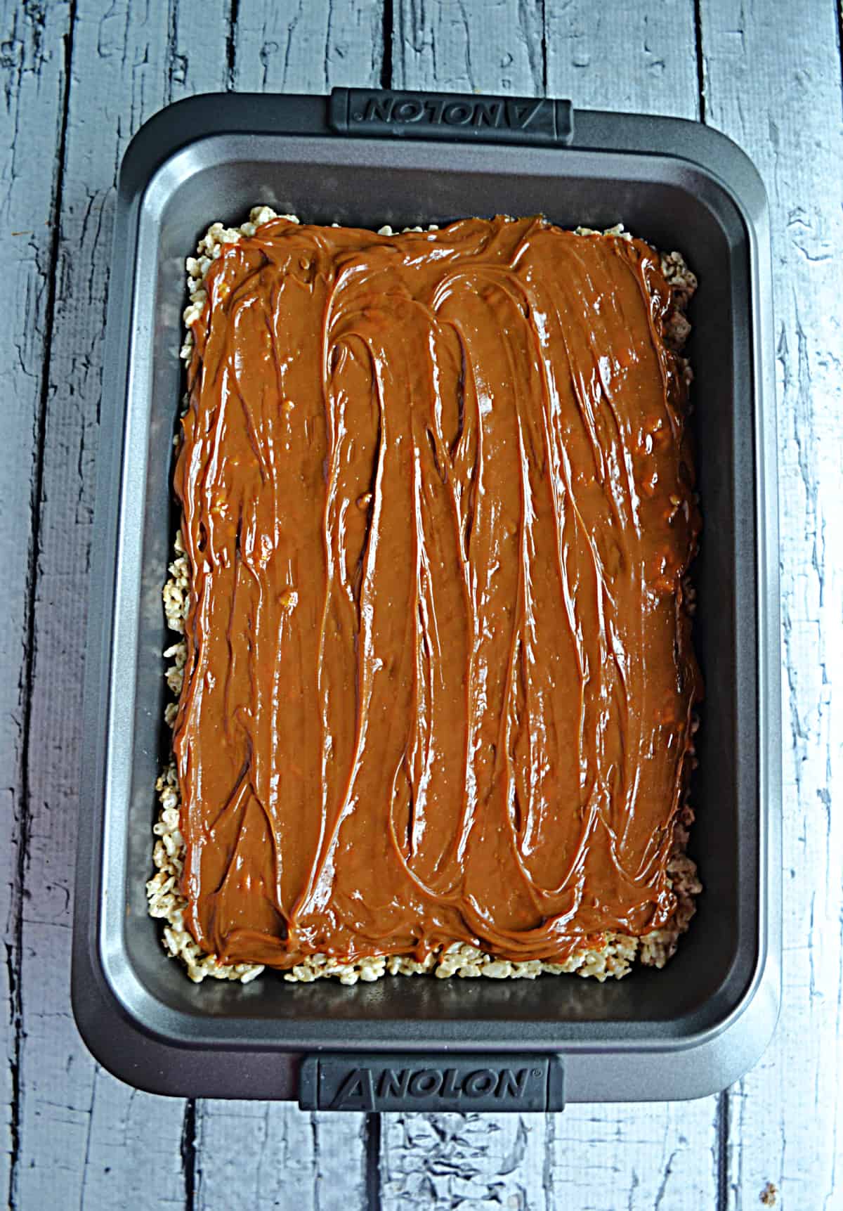 A pan of Rice Krispies Treats topped with Dulce de Leche