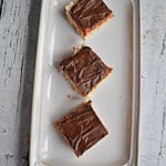A platter with three Dulce de Leche Rice Krispies Treaats squares.