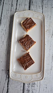 A platter with three Dulce de Leche Rice Krispies Treaats squares.