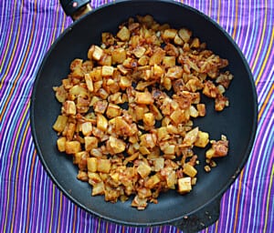 A skillet filled with breakfast potatoes