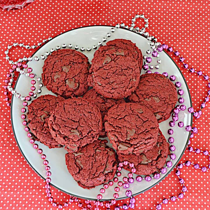 A plate of vegan red velvet cookies with beads on the plates.