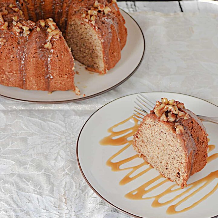 A close up of a slice of pecan cake drizzled with caramel and the whole Bundt cake before it.
