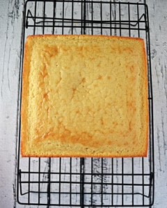 A cake cooling on a wire rack.