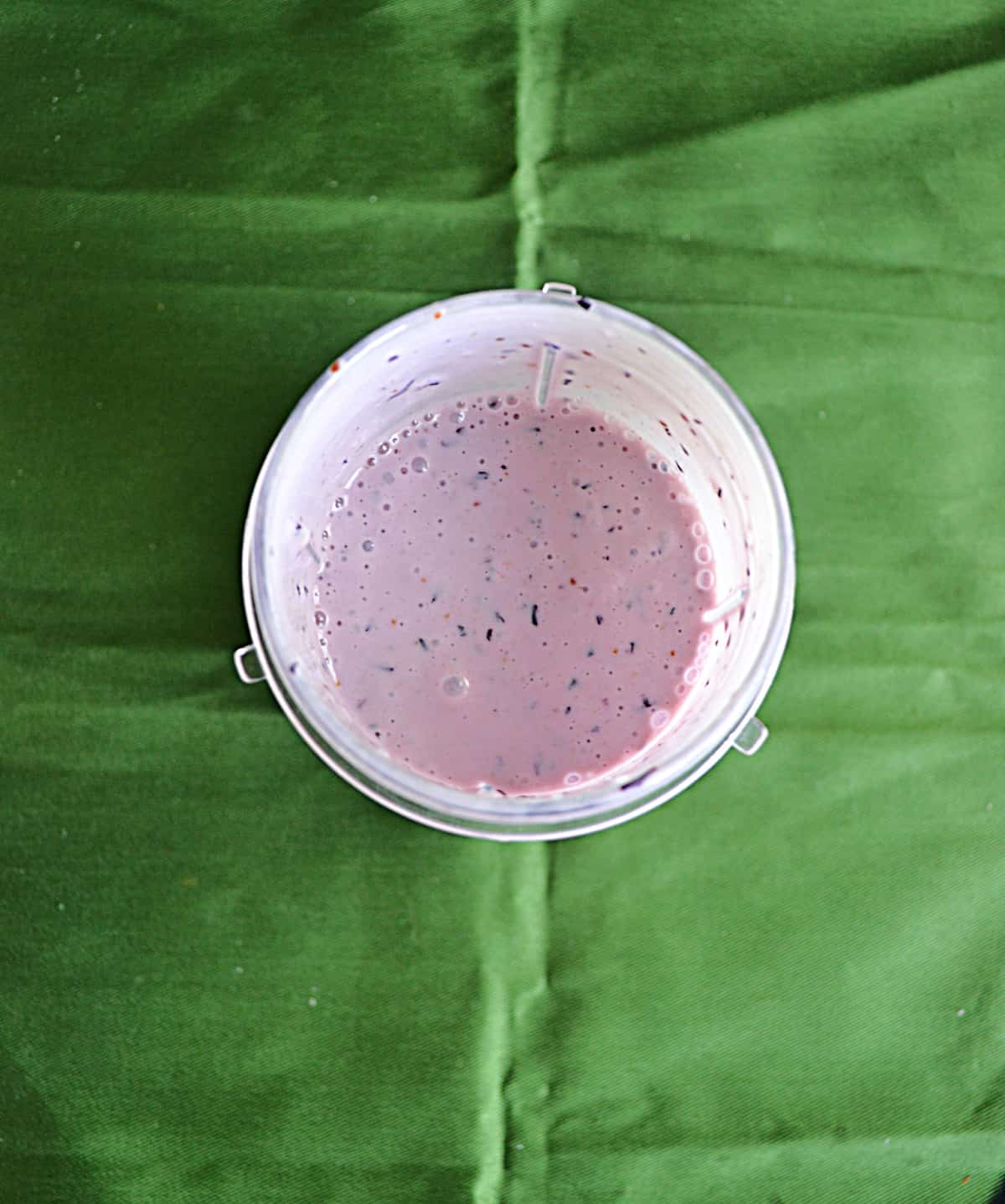 Top view of a blueberry banana smoothie.