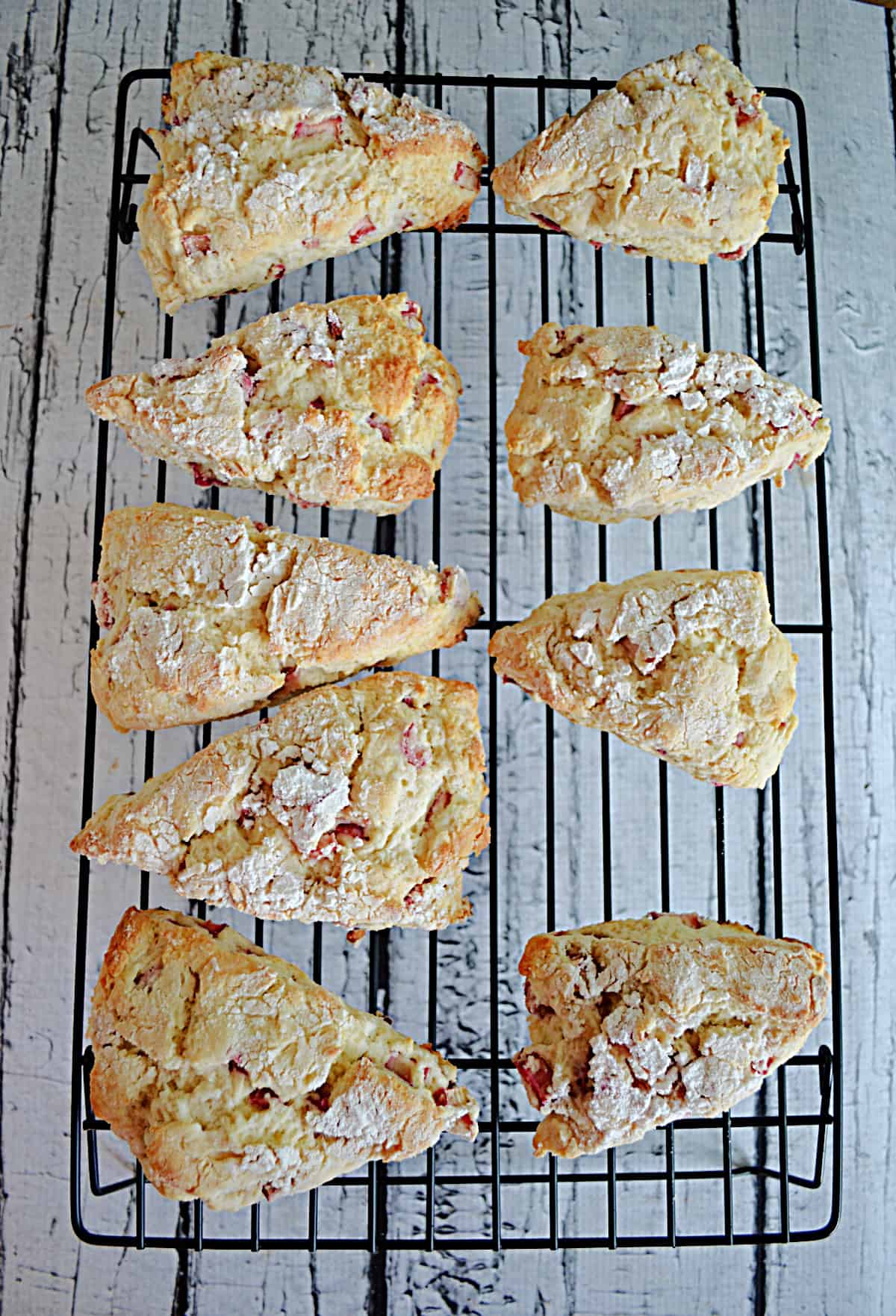 Golden brown scones on a cooling rack.