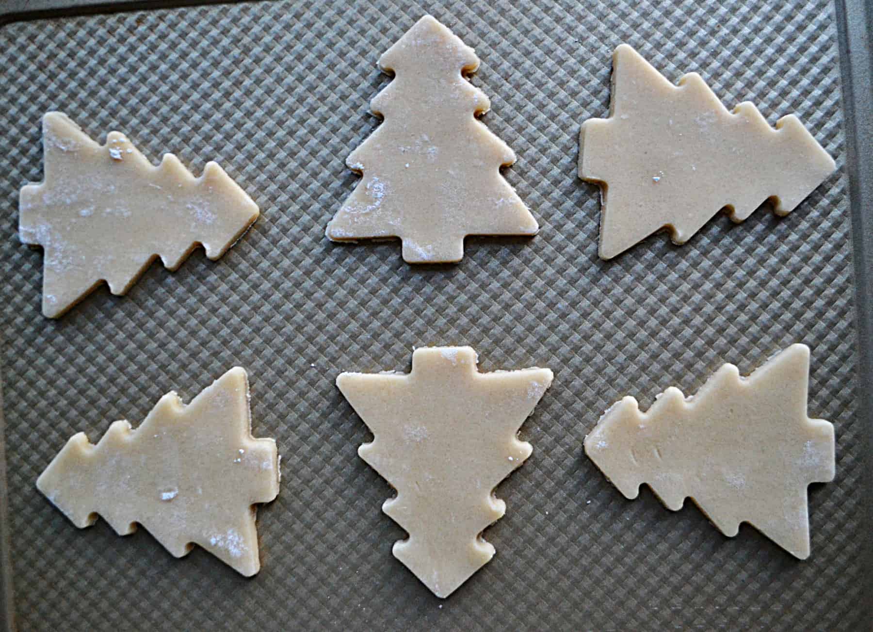 A sheet pan with cookie dough trees on it.
