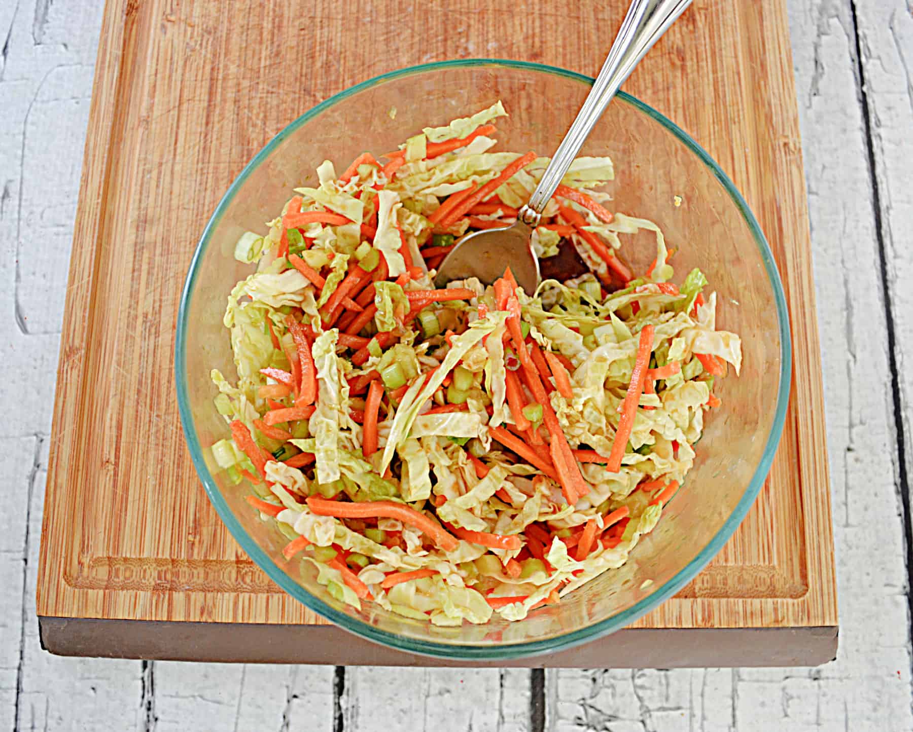 A bowl of cabbage and carrots.