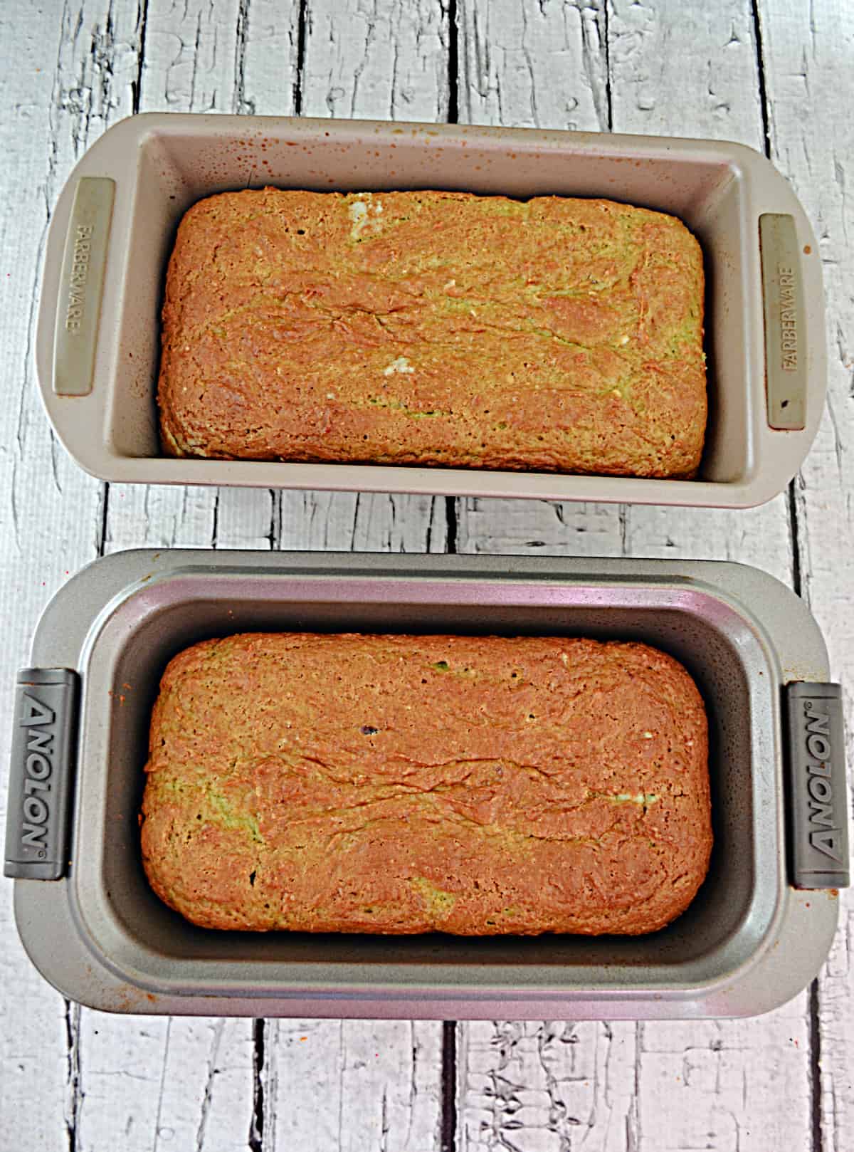 Two loaf pans with cake baked in them.
