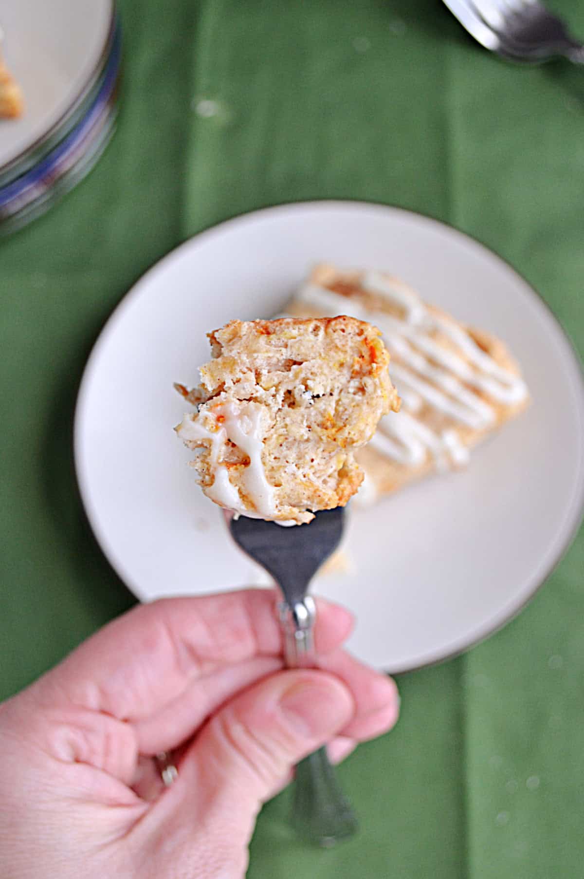 A fork holding a close up piece of scone.