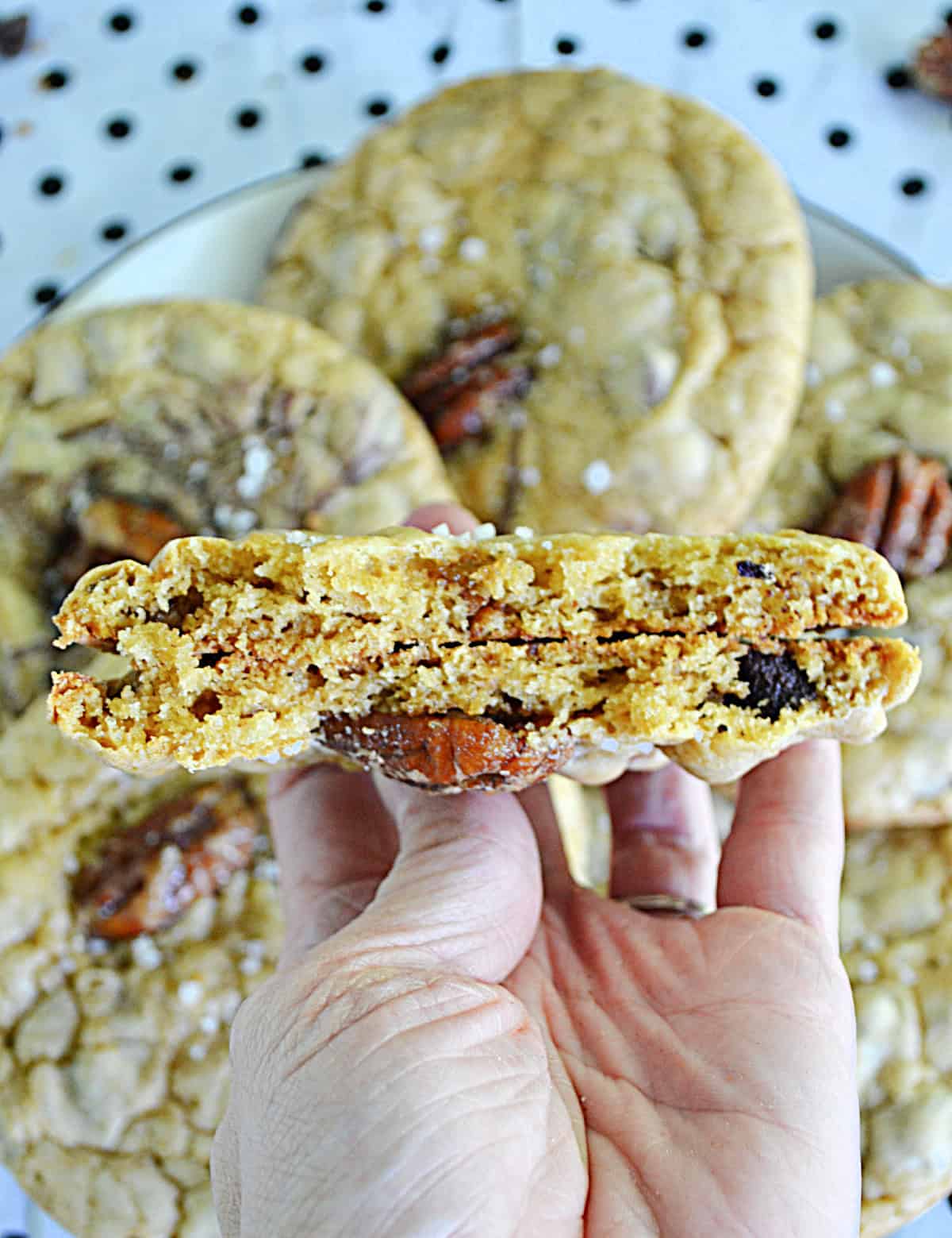 A cookies with a bite taken out of it.
