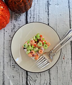A square of Apple Jacks cereal treats with 2 forks.