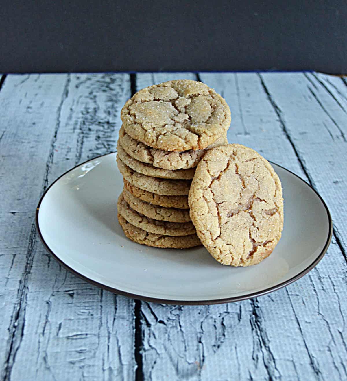 A stack of maple snickerdoodles stacked high on a plate.