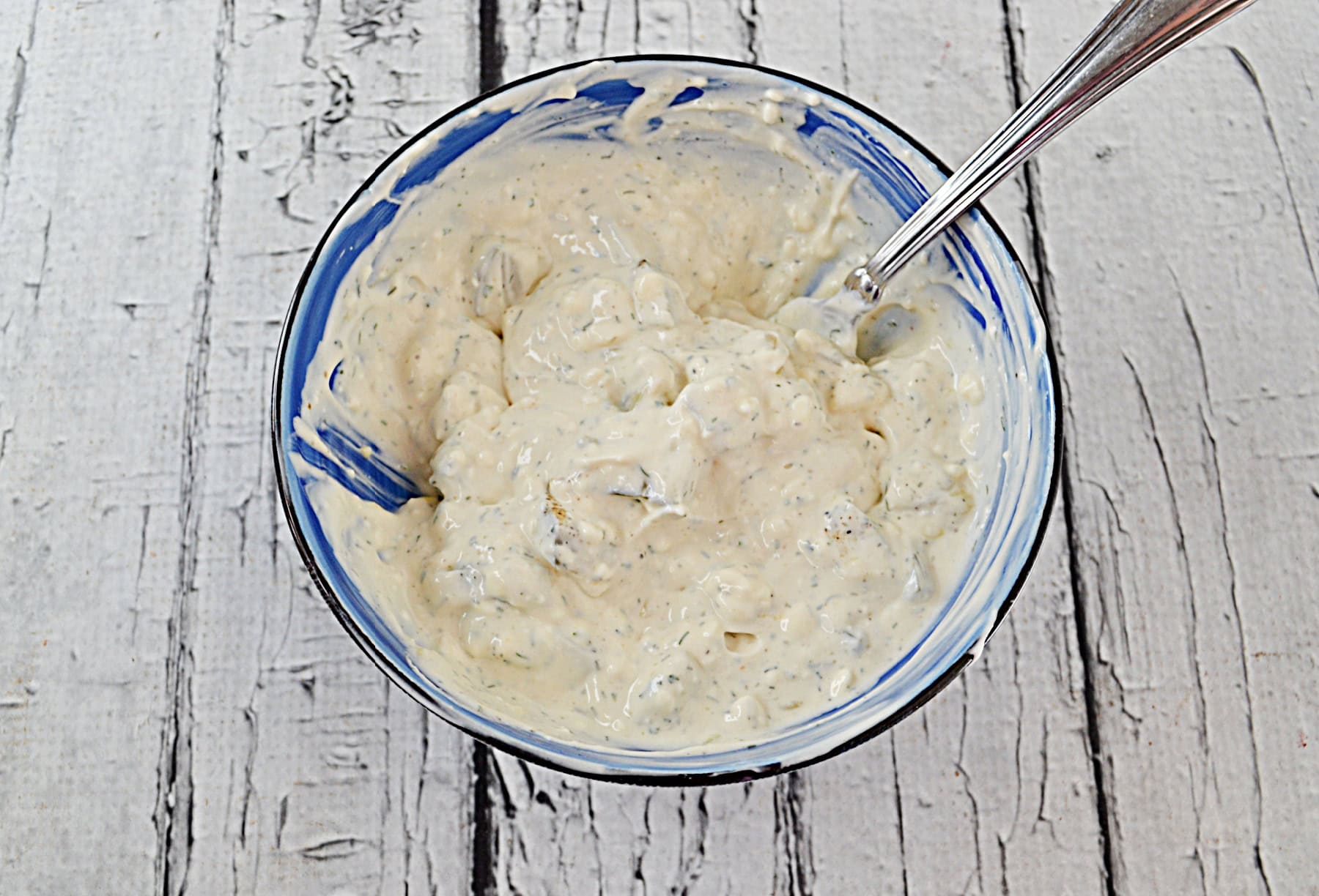 A bowl of pickle dip.