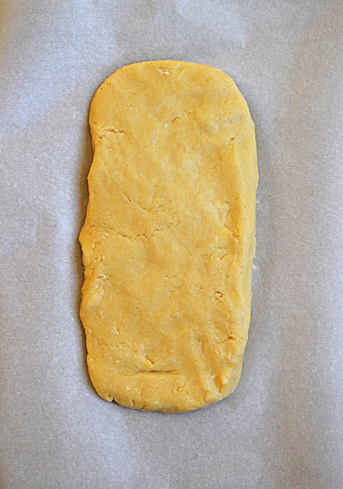 A rectangle of dough on a baking sheet.