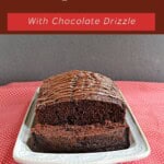 Pin Image: Title, a platter with a front view of chocolate bread with a slice cut off.