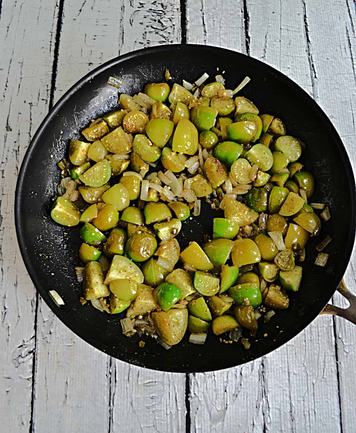 A skillet of tomatillos.
