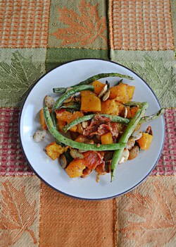 A plate of butternut squash and green beans.