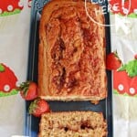 Pin Image: Title, a loaf of bread with a slice cut off on a platter.