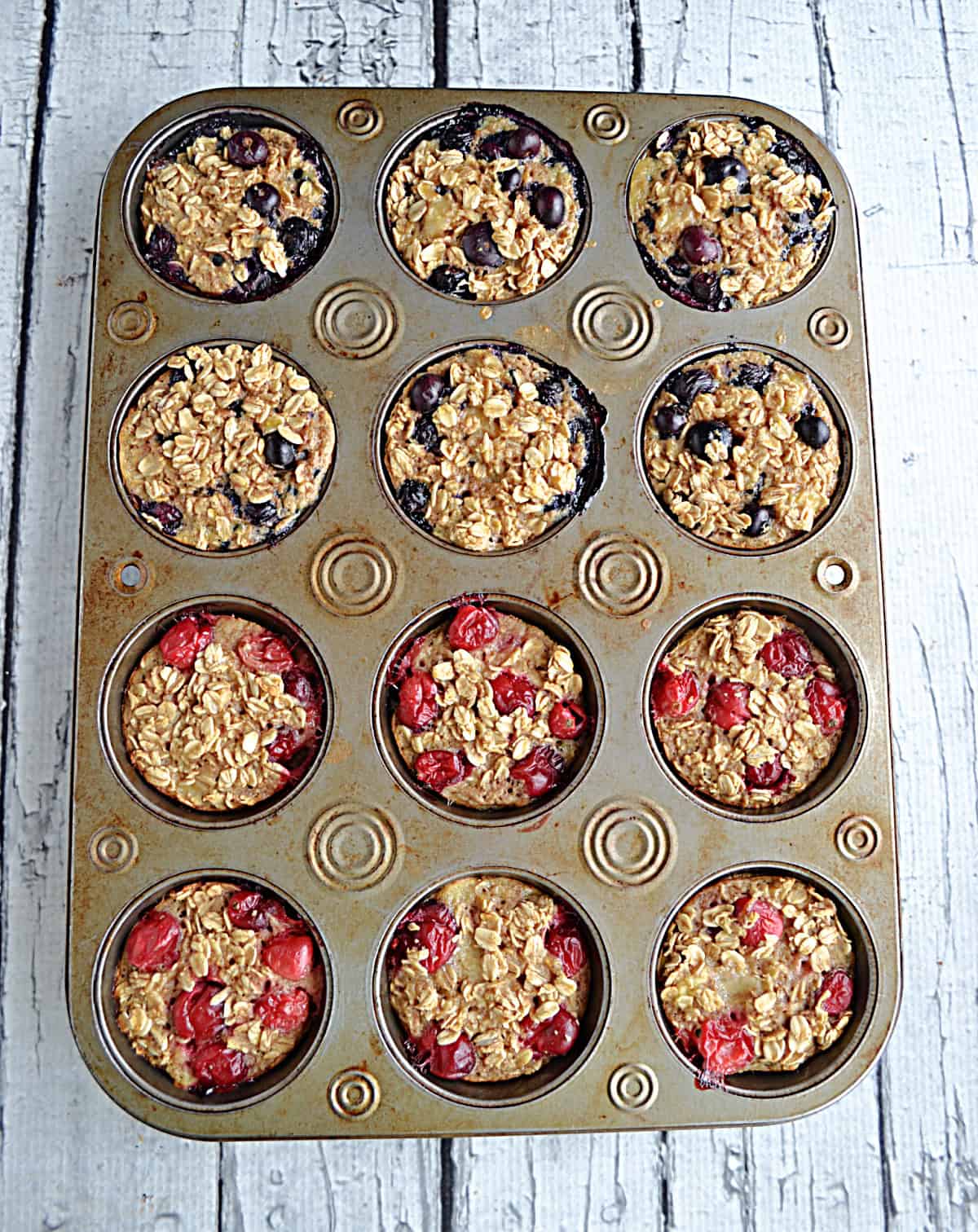 A muffin tin with oatmeal cups in it.