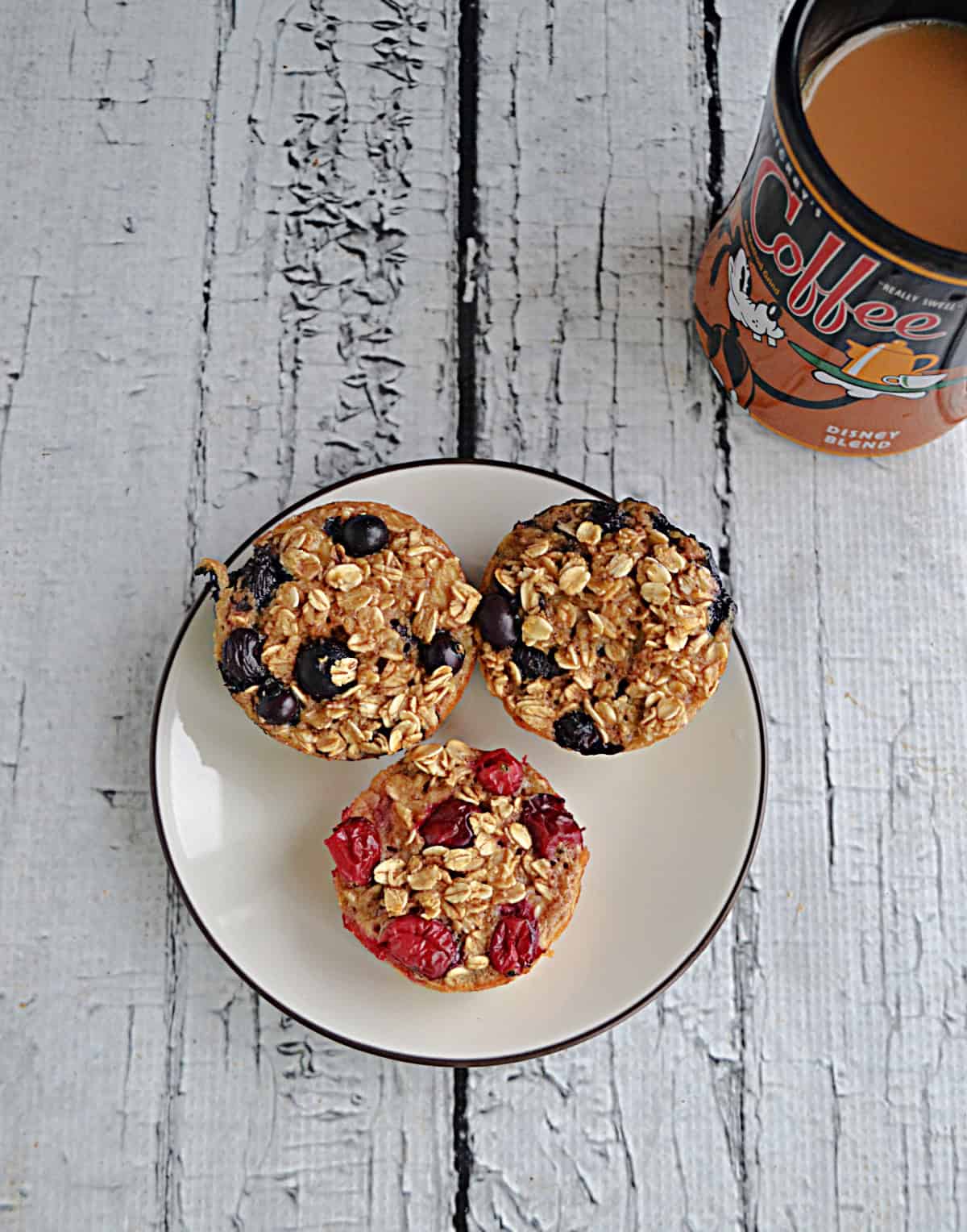 A plate of oatmeal cups with a mug of coffee.