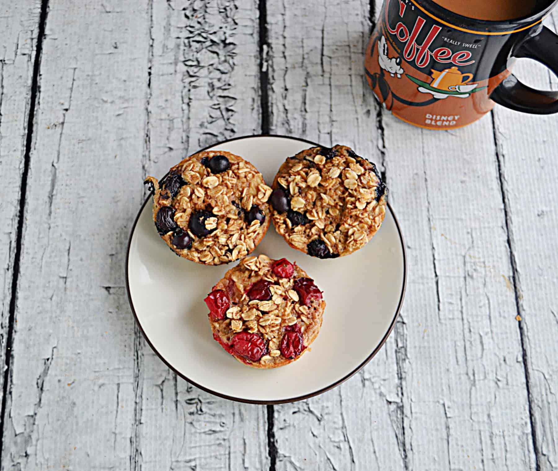 A plate of oatmeal cups with a cup of coffee.