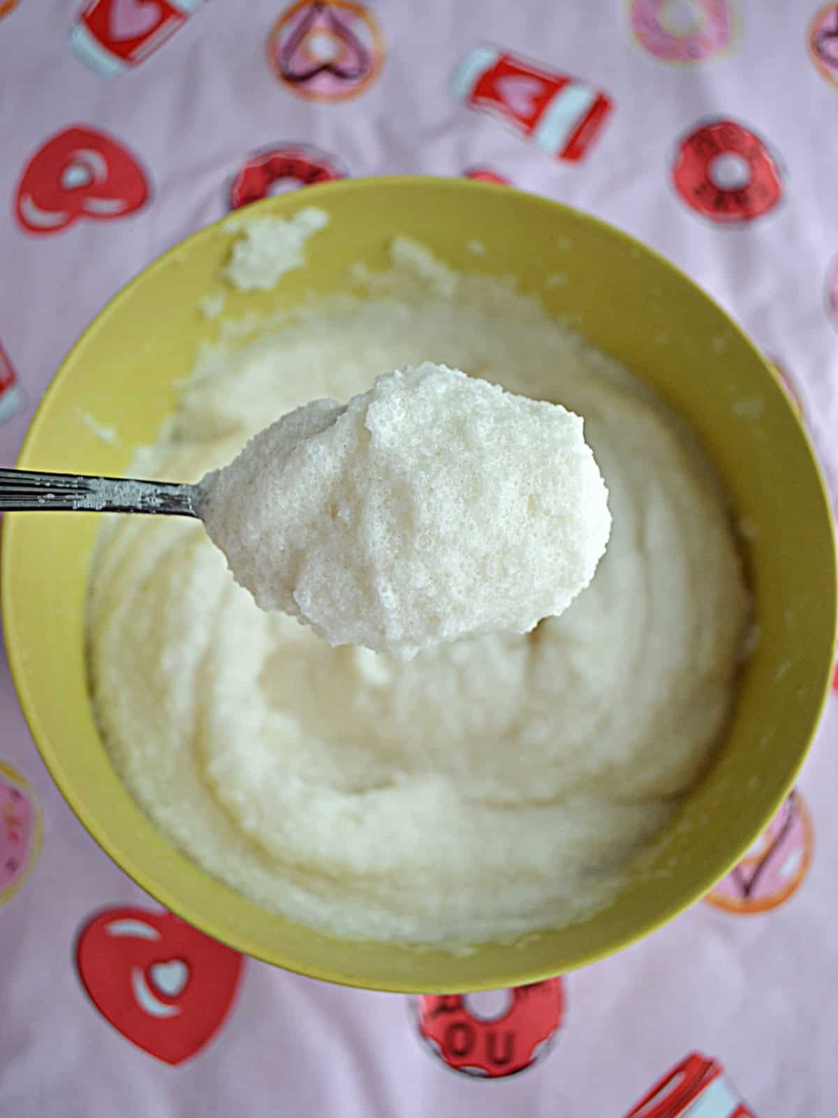 A spoon holding snow ice cream.