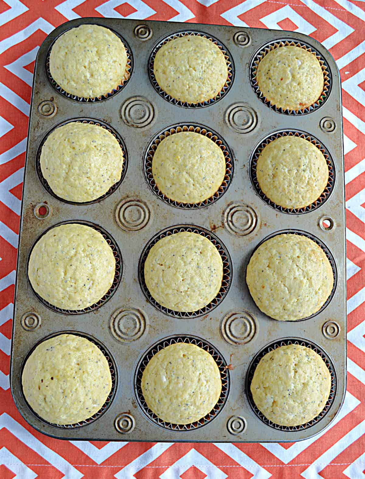 A muffin tin filled with muffins.