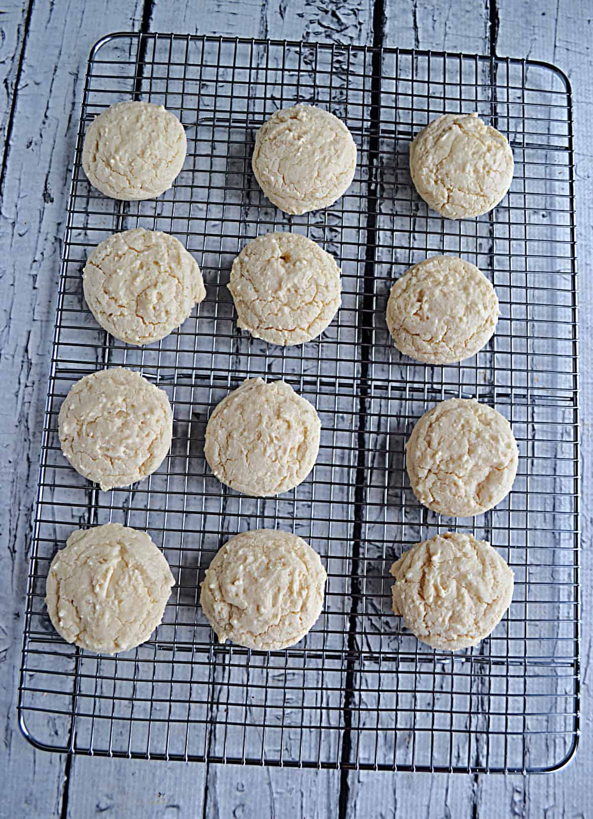 Sugar cookies on a wire cooling rack.