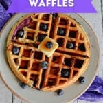 Pin Image: Title, A waffle with fresh blueberries, butter, and syrup on it.