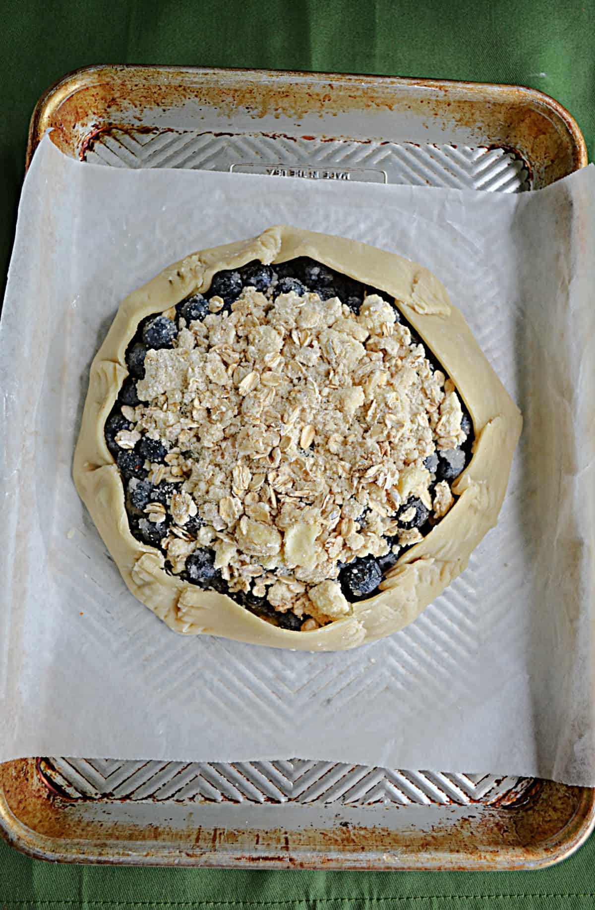 An unbaked rustic blueberry pie.