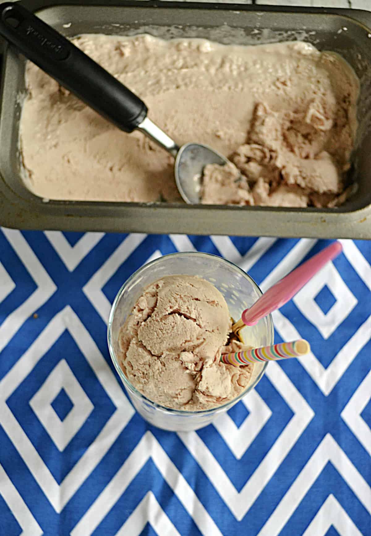 A pan with Copycat Wendy's Frosty in it and a cup with a scoop of the Frosty plus a spoon in it.