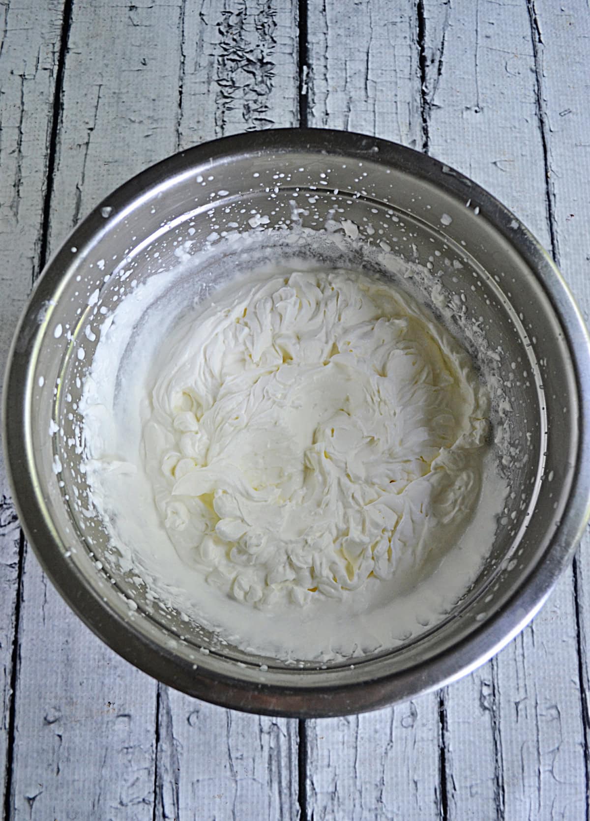 A bowl of fresh whipped cream.